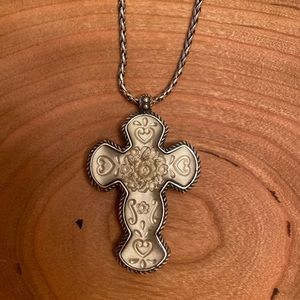 Silver plated, hammered, convertible cross necklace with lobster claw closure.